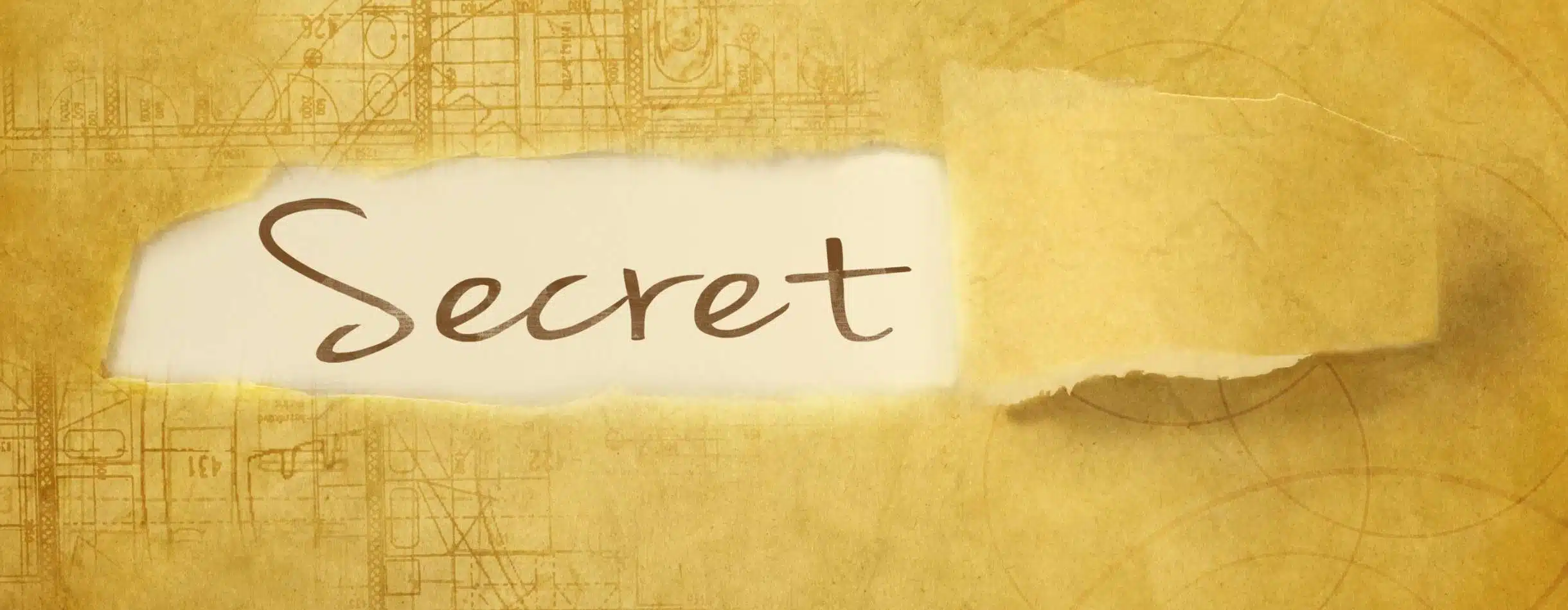 After peeling away a piece of wrapping paper, Secret is revealed to be written on the parchment underneath.