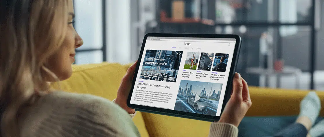 women looking at news on her tablet