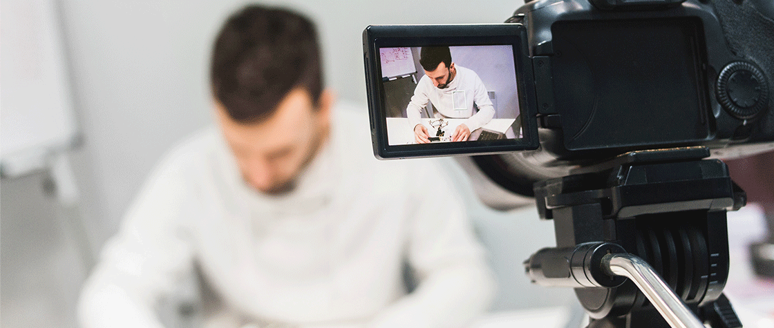 man creatiing video content