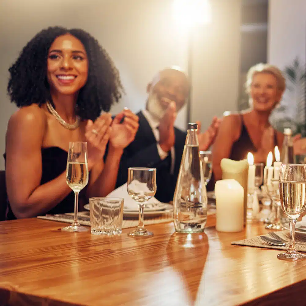 People, Restaurant And Clapping At Celebration In Night For Friends, Business Executive Team Or Happy For Success. New Year, Applause Or Gala Party With Champagne, Congratulations Or Group Motivation