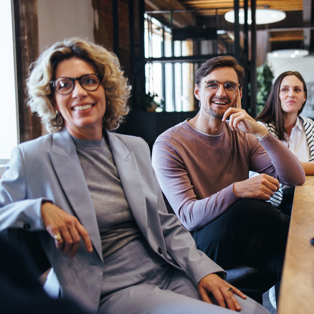 Business Colleagues Listening To A Discussion In A Meeting