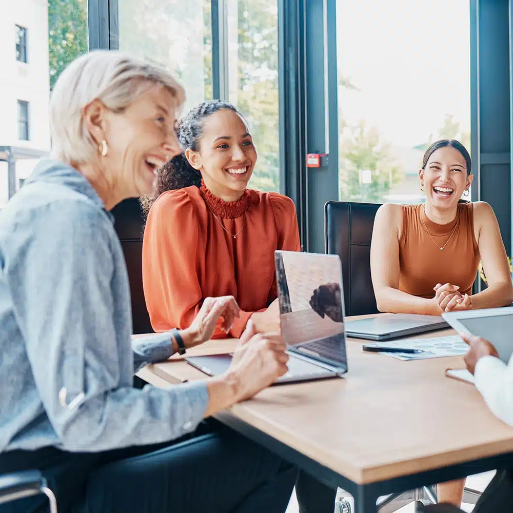 Laughing, Planning Business And Women In A Meeting For Strategy, Teamwork And A Workforce Team. Happy, Office And Diversity With People At Work For A Corporate Collaboration And Coworking Together