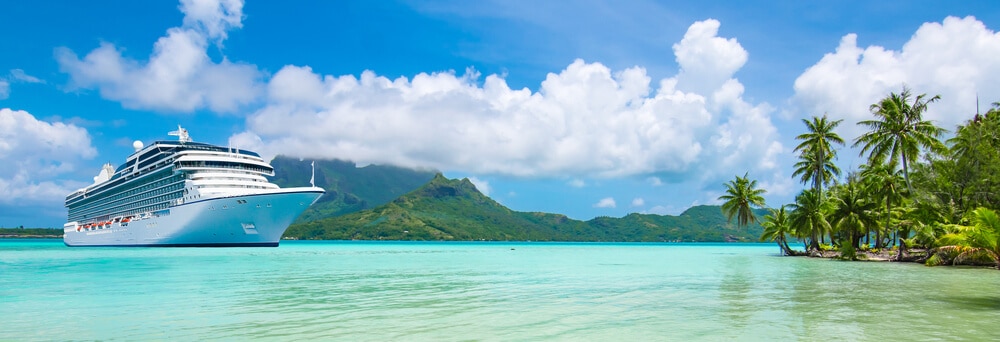 A cruise ship in a tropical paradise, representing a popular live auction item 