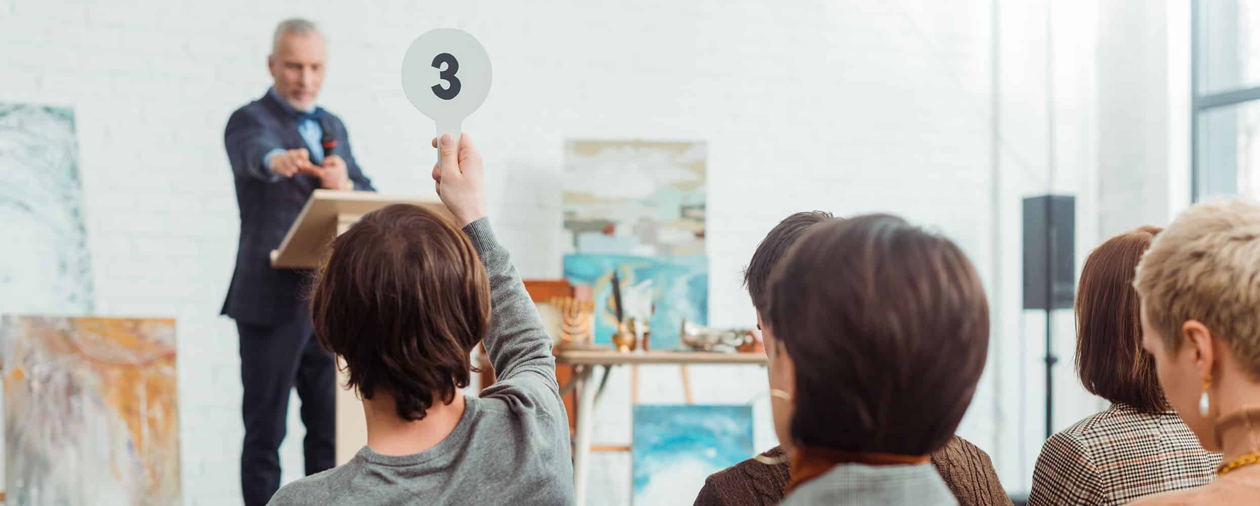 Someone bids on a live auction item