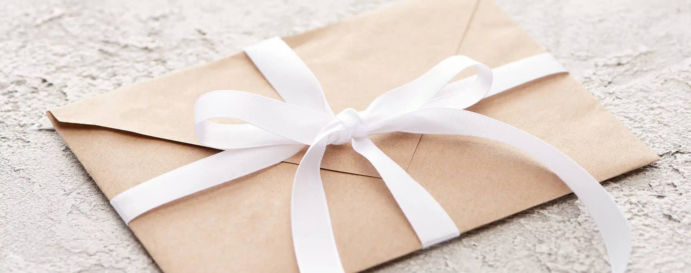 picture of envelope with ribbon tied on it