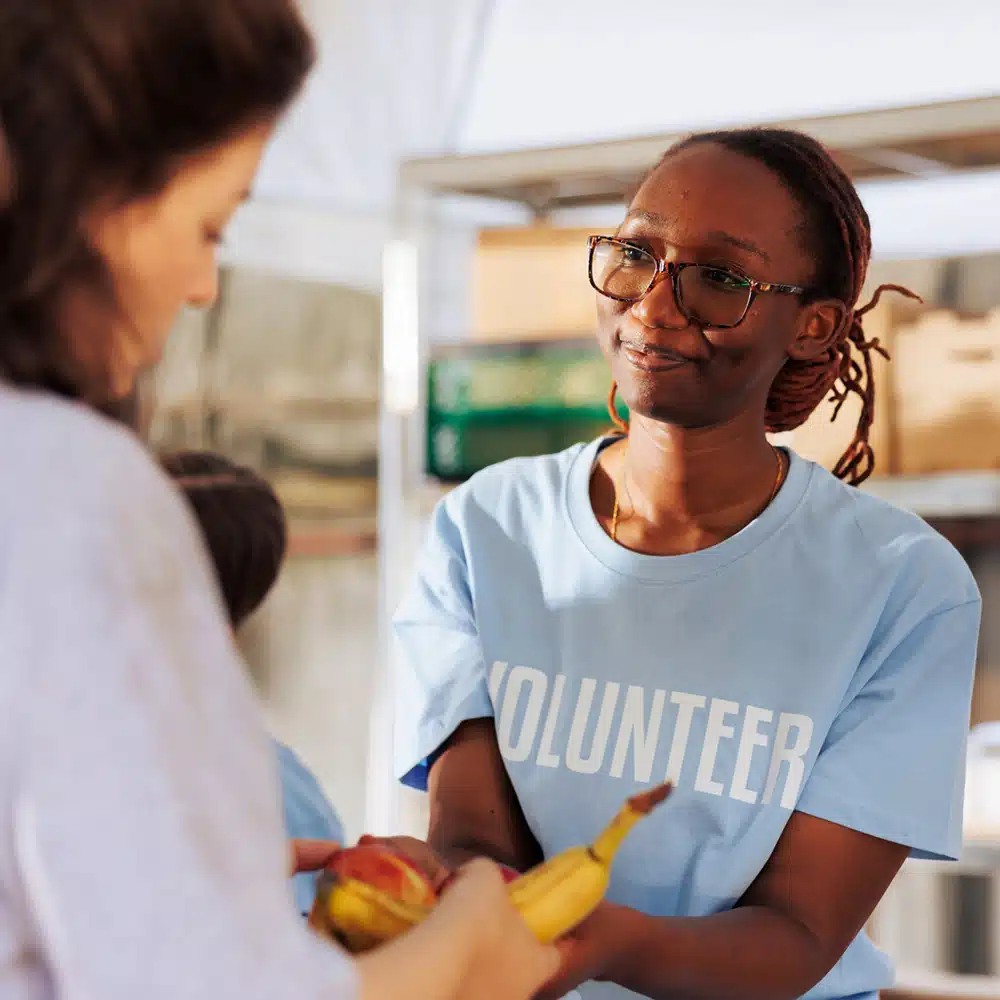 Woman Sharing Nourishments To The Needy