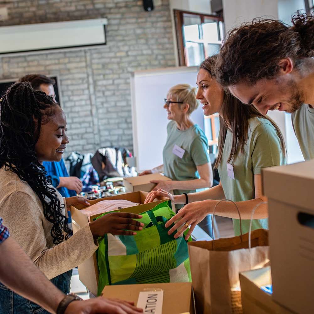 Group Of Volunteers With Working In Community Charity Donation C