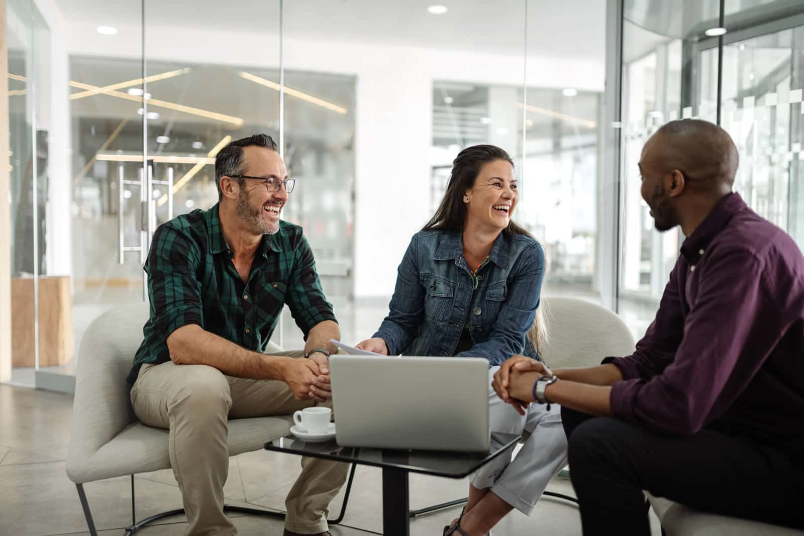 Nonprofit employees sitting together at work.