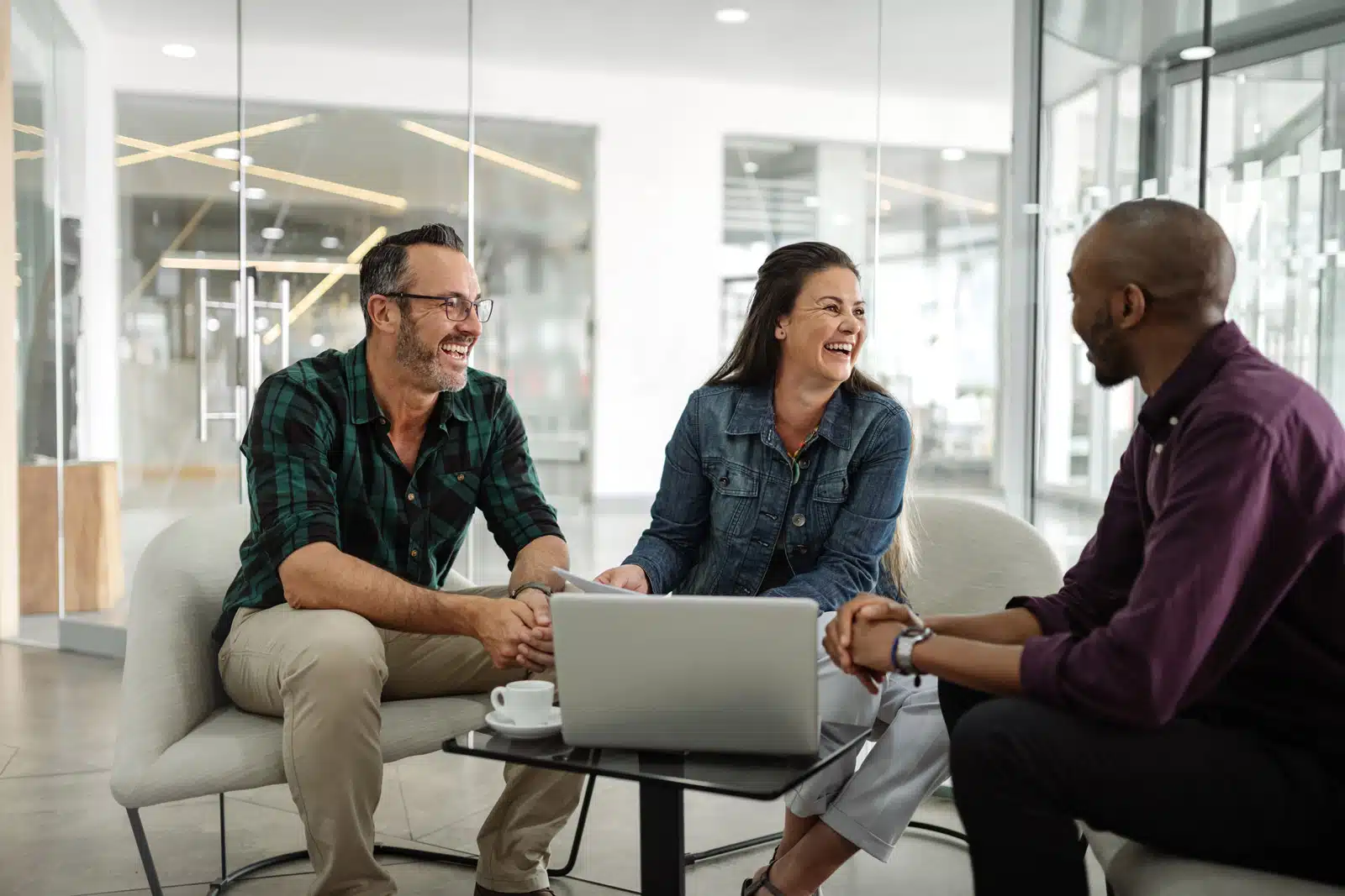 Nonprofit employees sitting together at work.