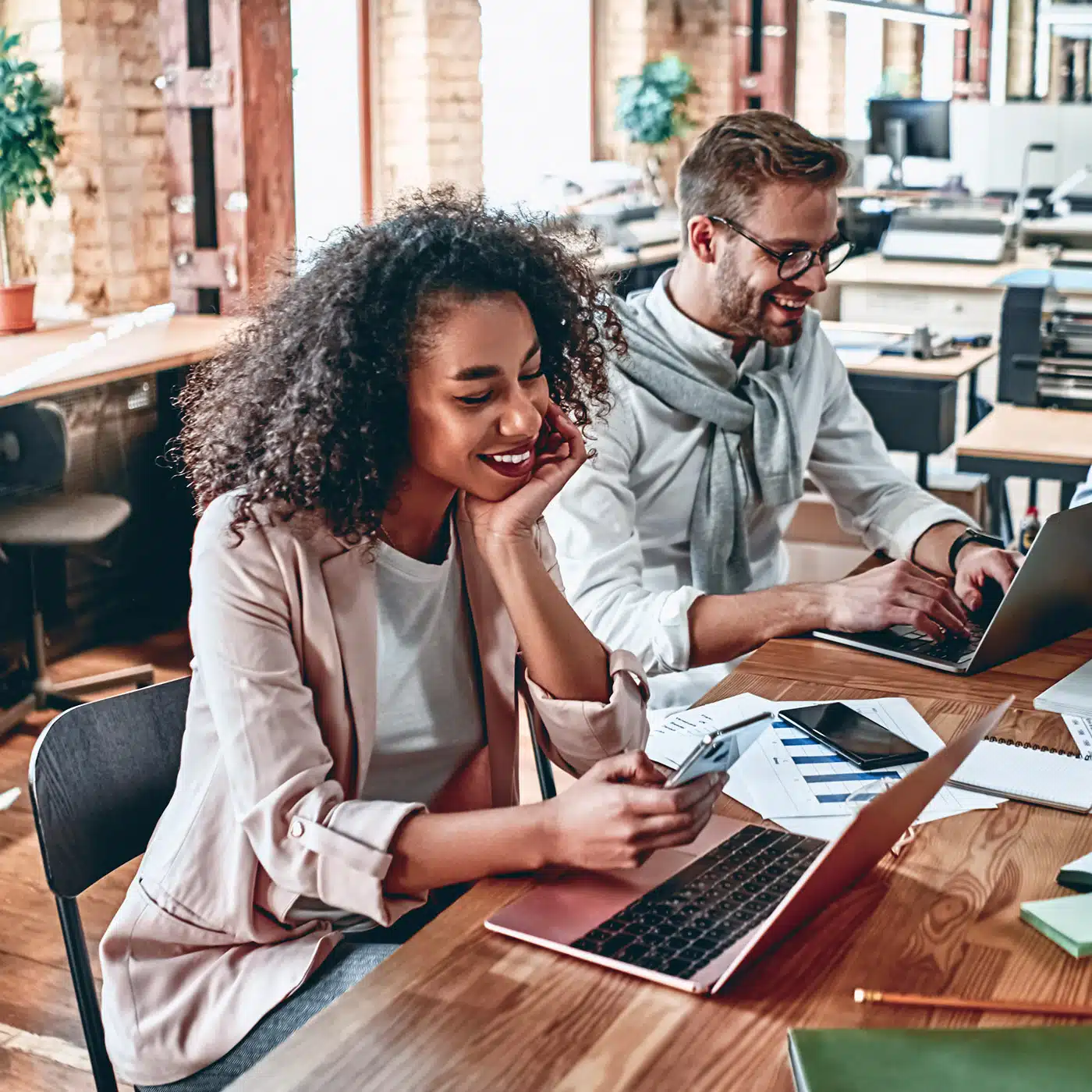 People smiling at desk
