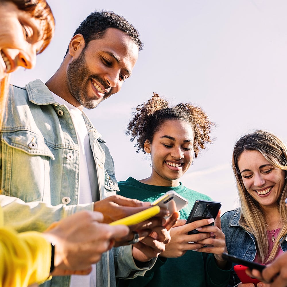 Group of people using fundraising apps on their phone