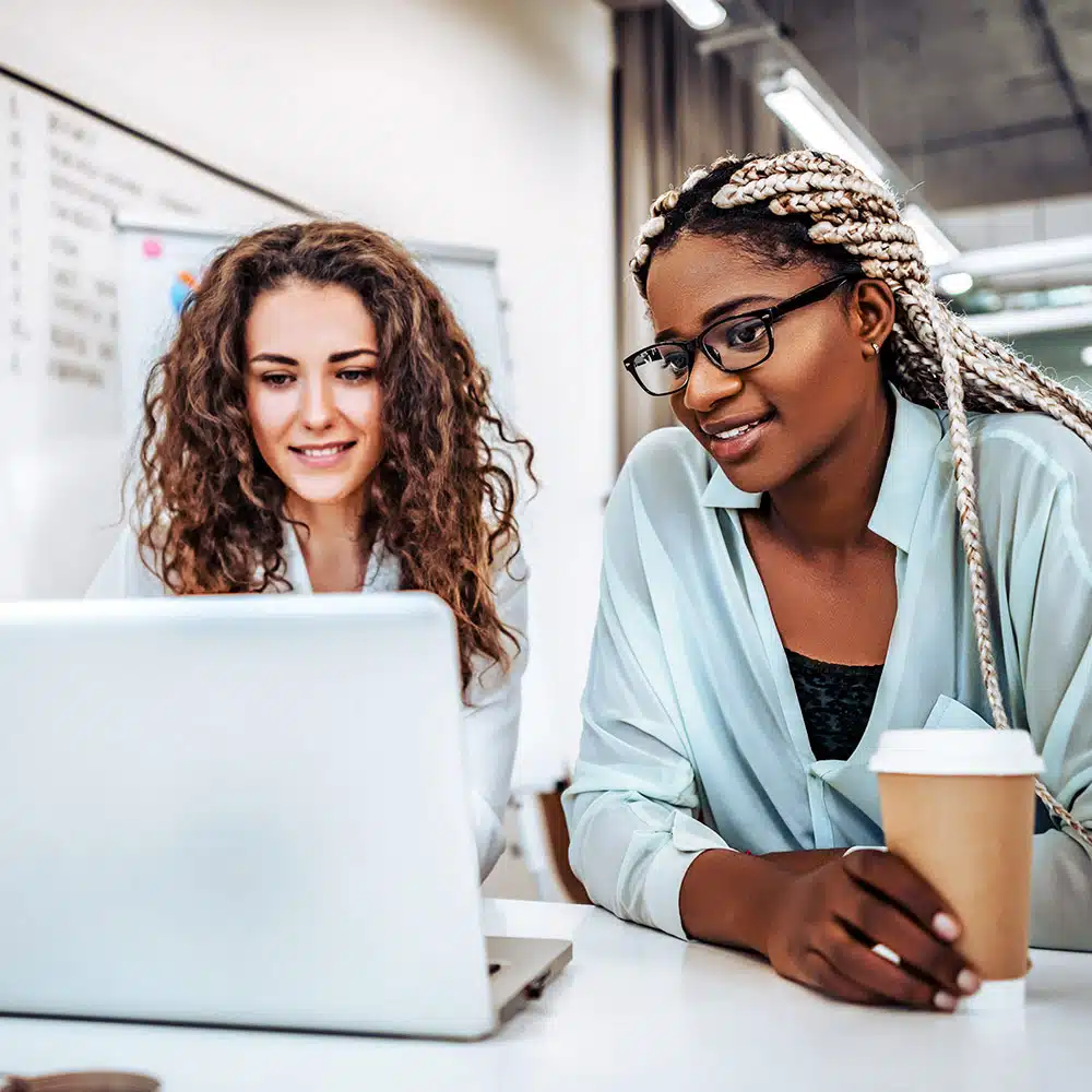 Two Women Happy At Computer