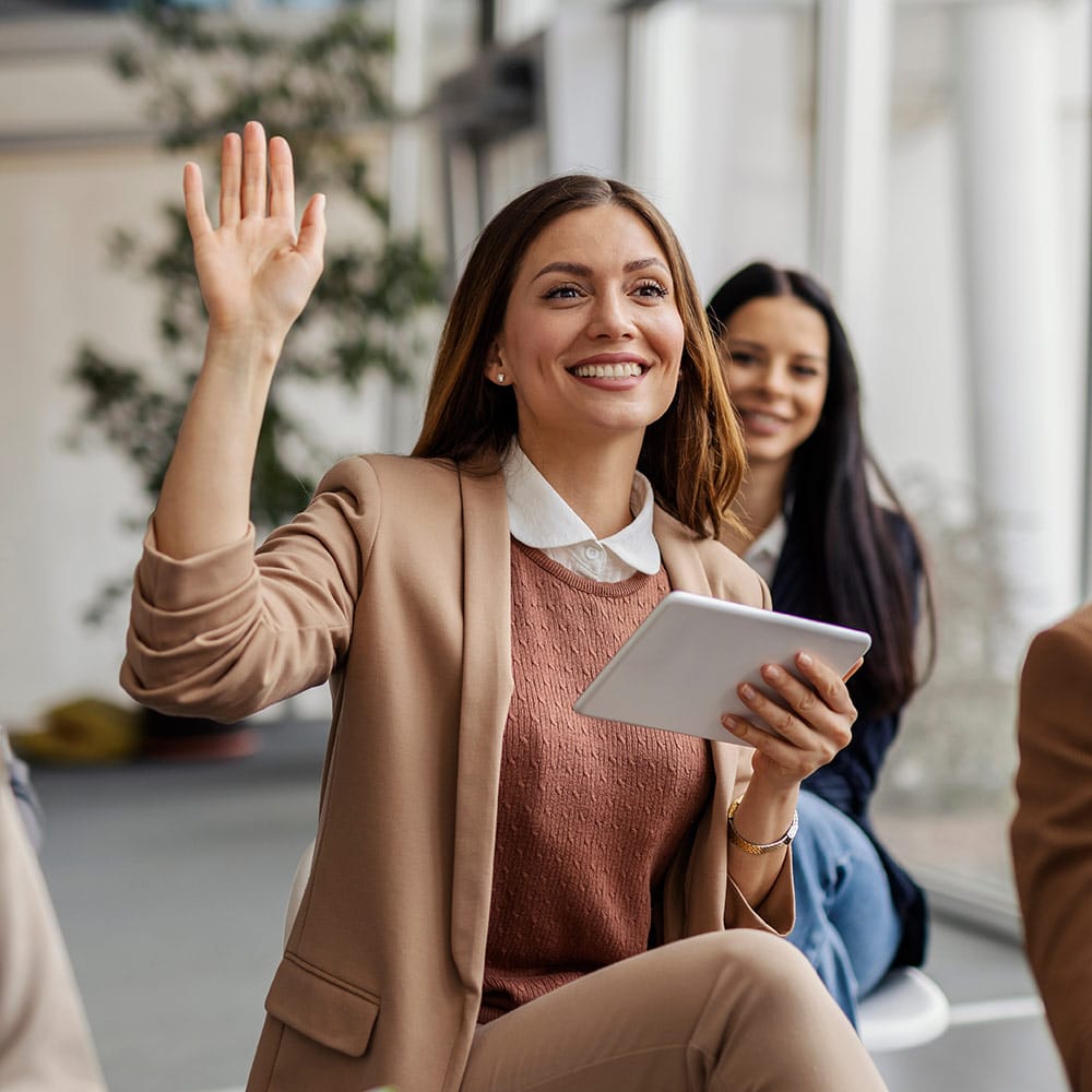 Woman raising hand at auction