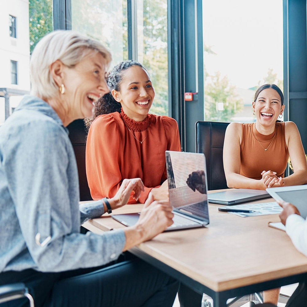 Smiling women at desk