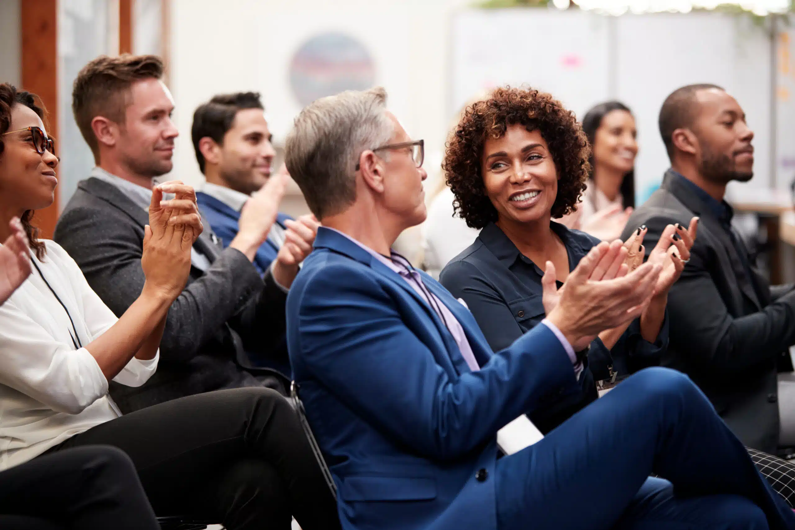 nonprofit attendees applauding after a presentation